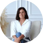 A woman sitting on the armchair.