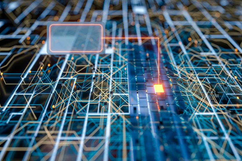 The image depicts a 3D-rendered abstract visualization of a digital circuit board, with intricate lines representing data pathways and connections. The scene features illuminated nodes and intersections, symbolizing data transfer and communication across the network. A highlighted area with a glowing orange light and a blank rectangular overlay suggests a data processing point or a focal area for computational activity. The overall appearance conveys a high-tech, futuristic theme related to digital infrastructure and connectivity.